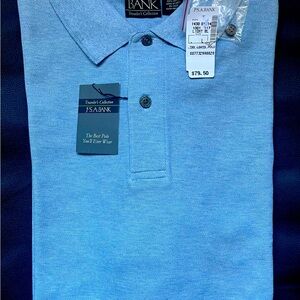 BRAND NEW WITH TAGS!! JoS. A. BANK MENS LIGHT BLUE POLO. TRAVELER’S COLLECTION.